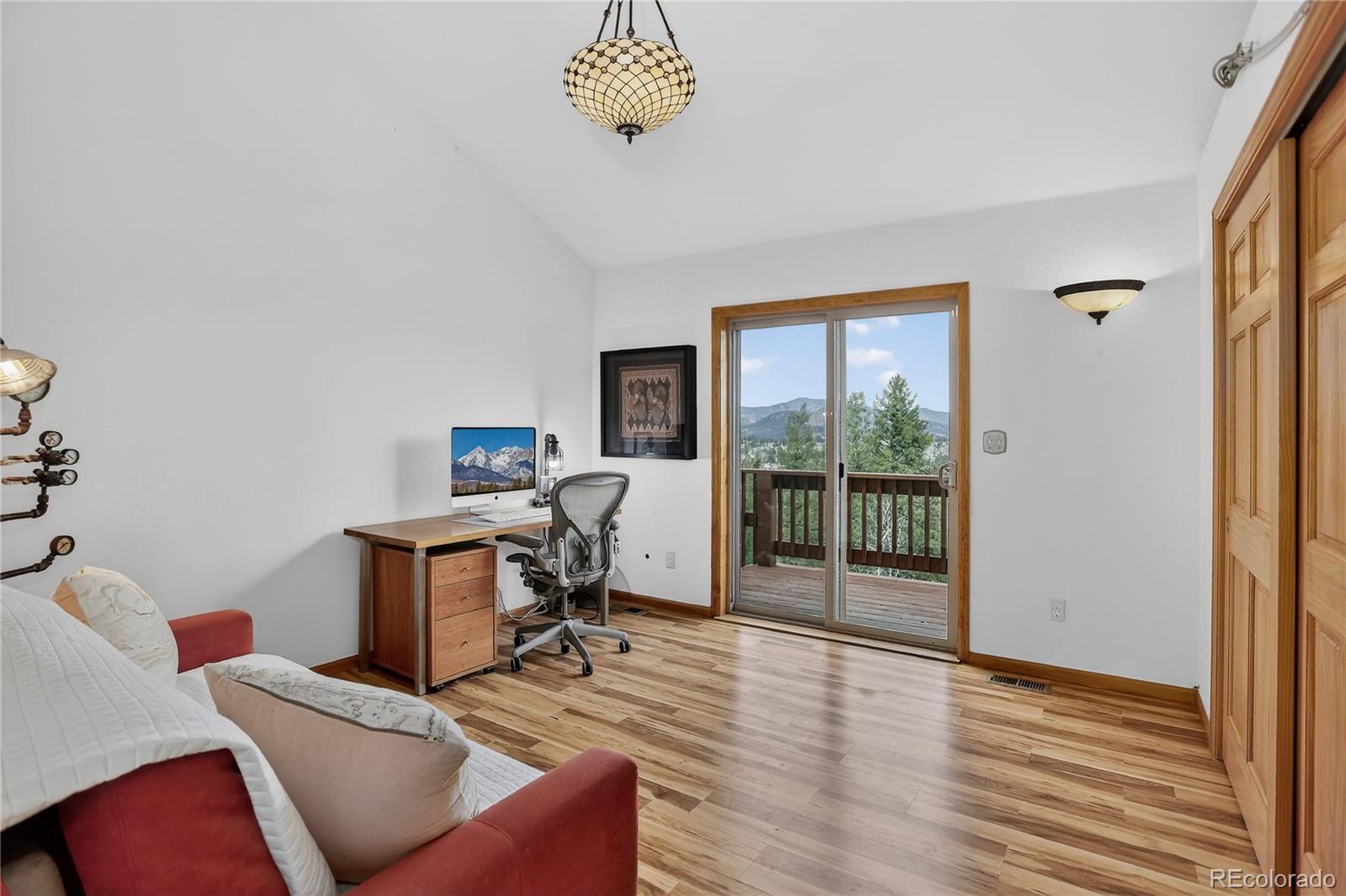 261 Mt Bailey Drive Bailey, CO 80421 - Photo 10 of 28 a workspace with furniture hardwood and a window