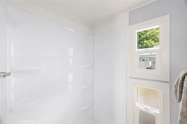 a picture of a bathroom with a window