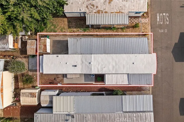 a view of a street with lots of bushes