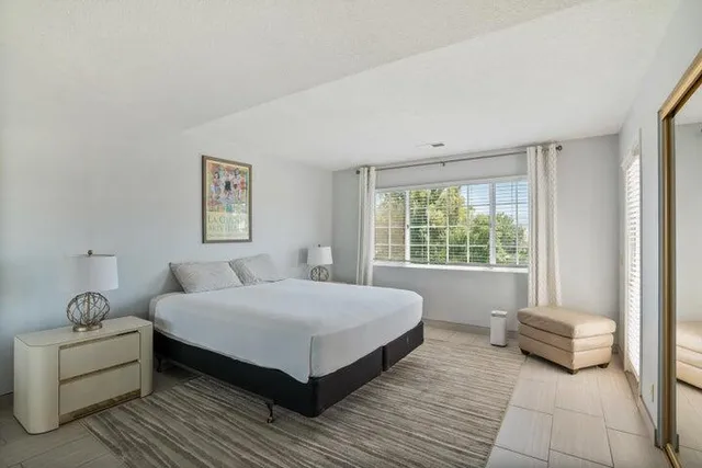 a bedroom with a bed and a couch