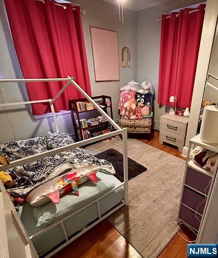 15 Hackensack Street East Rutherford, NJ 07073 - Photo 12 of 26 a room with lots of white furniture and a rug