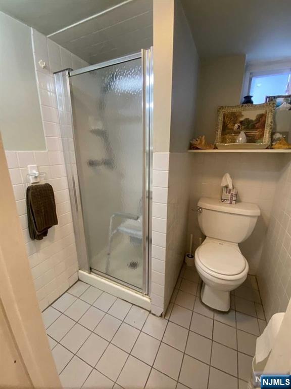 15 Hackensack Street East Rutherford, NJ 07073 - Photo 18 of 26 a bathroom with a toilet and a shower