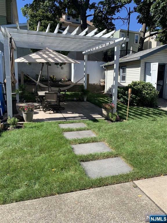 15 Hackensack Street East Rutherford, NJ 07073 - Photo 24 of 26 a view of a house with backyard porch and sitting area