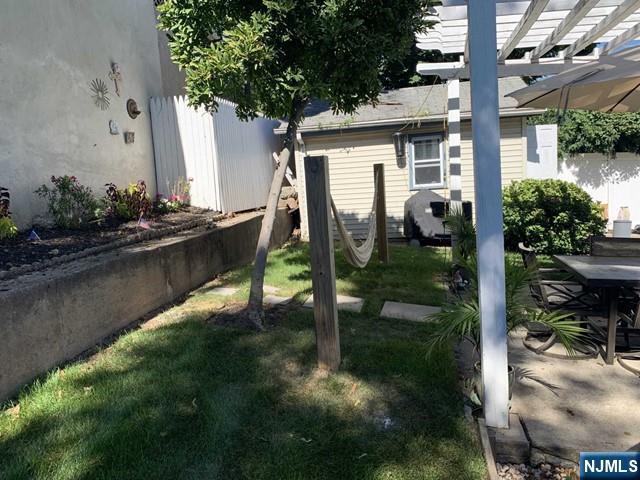 15 Hackensack Street East Rutherford, NJ 07073 - Photo 26 of 26 a backyard of a house with lots of green space