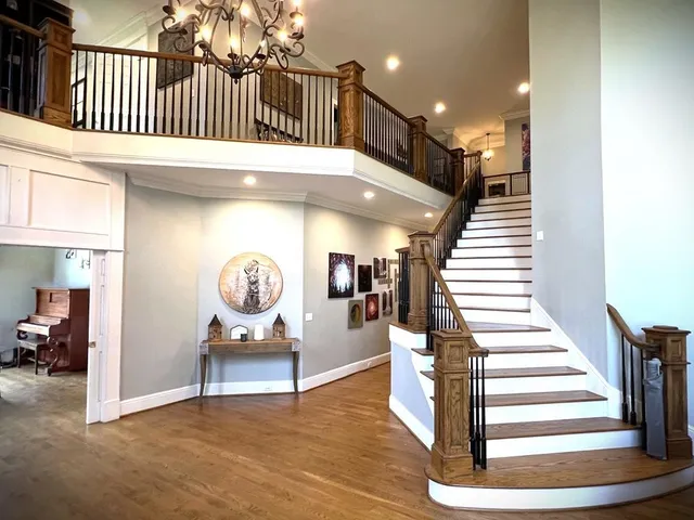 a kitchen with stainless steel appliances white cabinets and a granite counter tops
