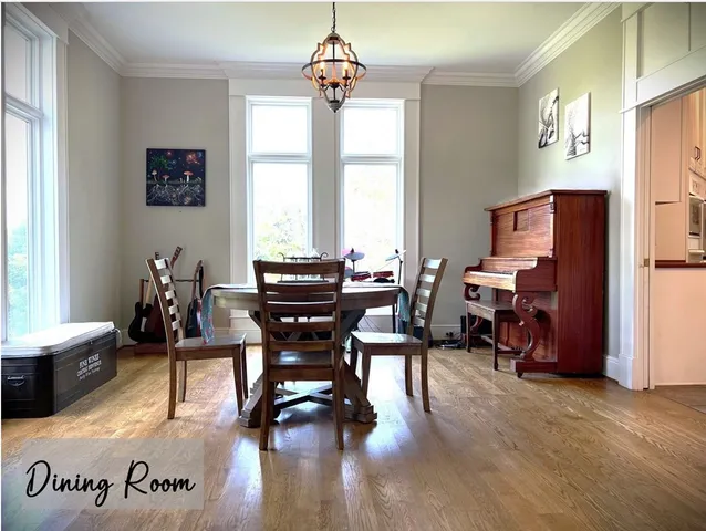 a bedroom with furniture and a wooden floor