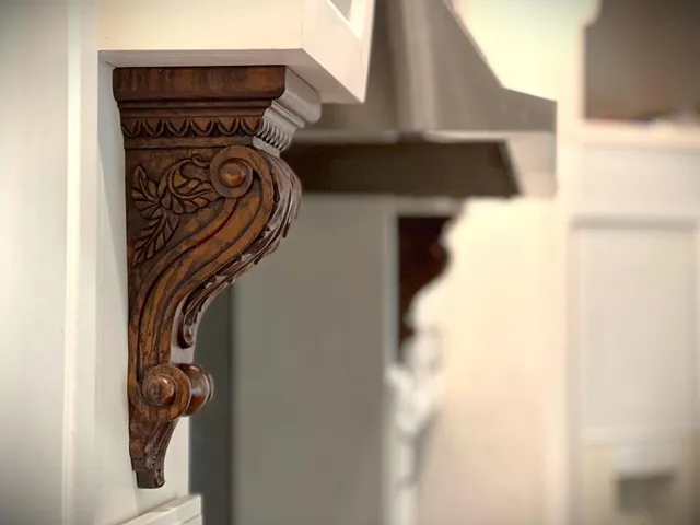 a kitchen with a refrigerator and cabinets