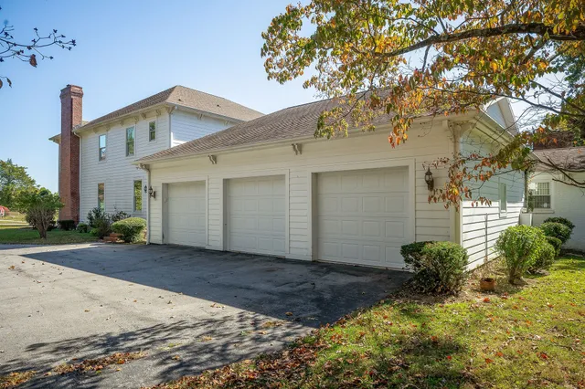 a view of a hallway with entryway wooden floor and front door