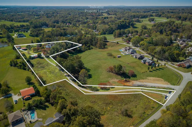 a living room with furniture kitchen view and a wooden floor