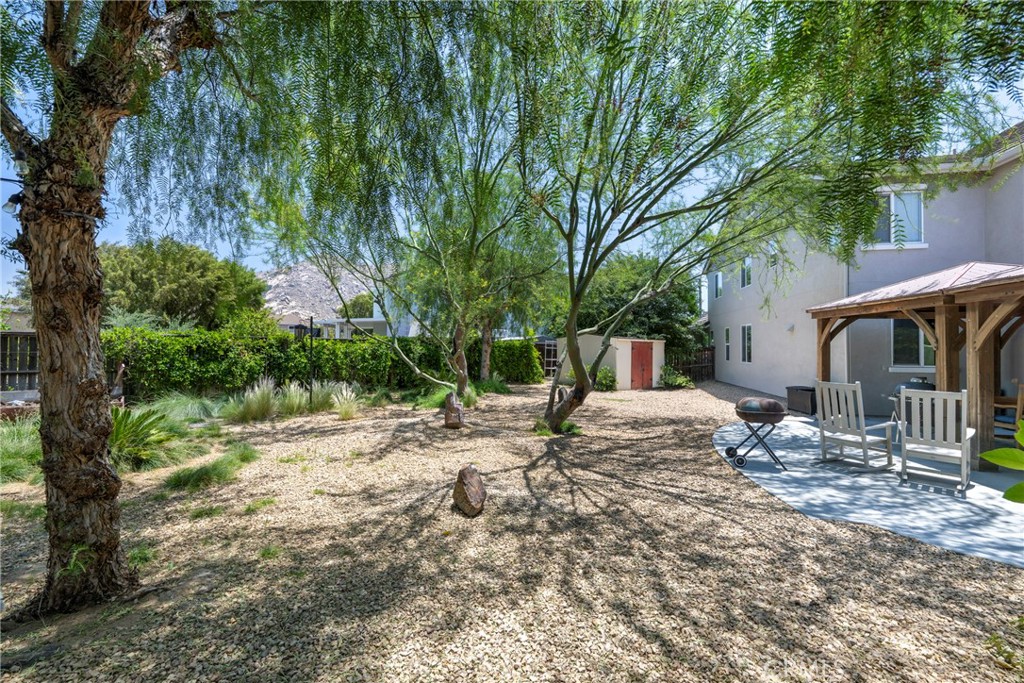 3819 St Austell Way Perris, CA 92571 - Photo 54 of 64 a backyard of a house with barbeque oven