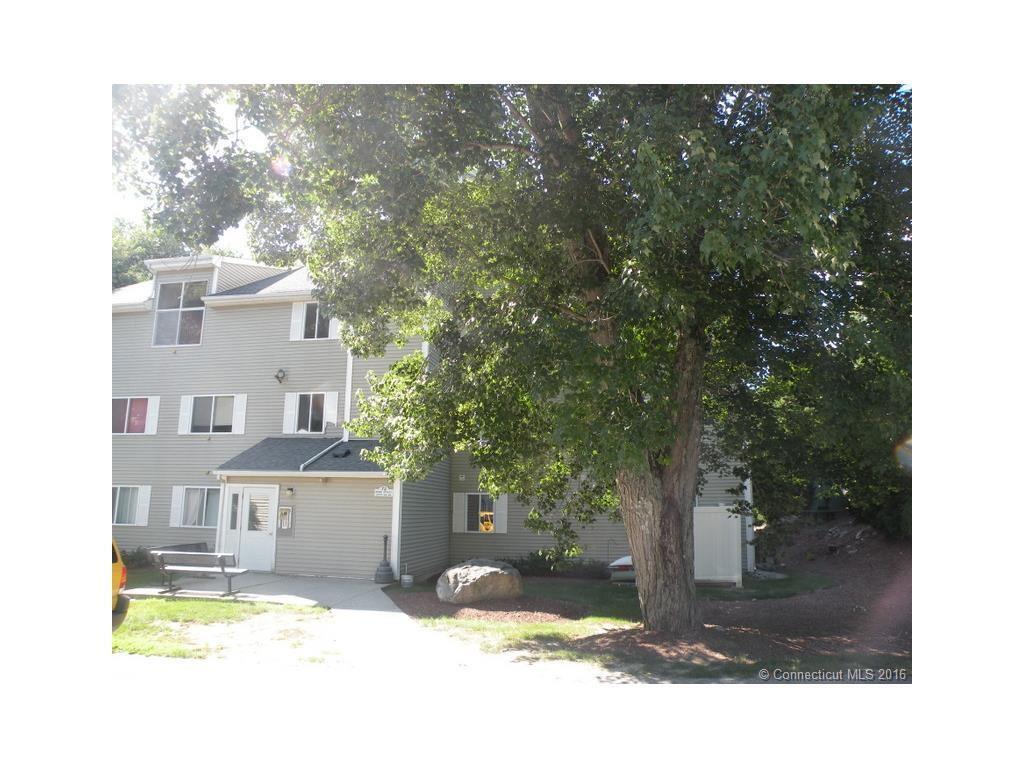 72 Perry Street, Unit 149 Putnam, CT 06260 - Photo 1 of 1 a view of a house with a yard