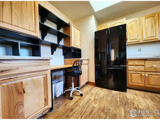 a kitchen with a refrigerator stove and cabinets