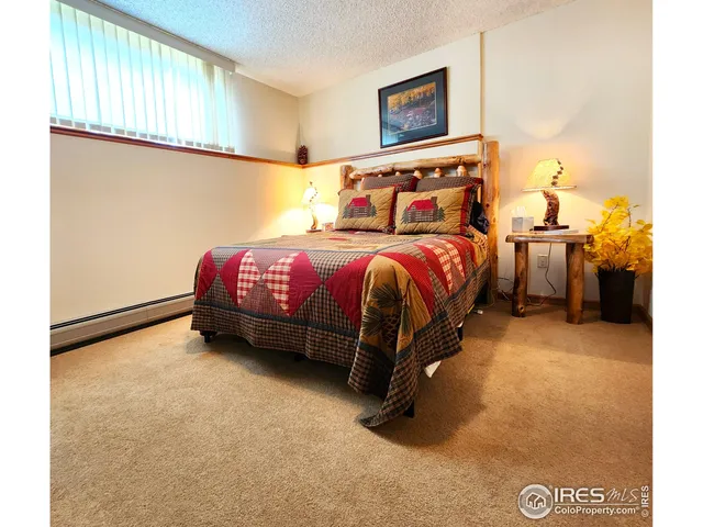 a living room with a couch and a chandelier