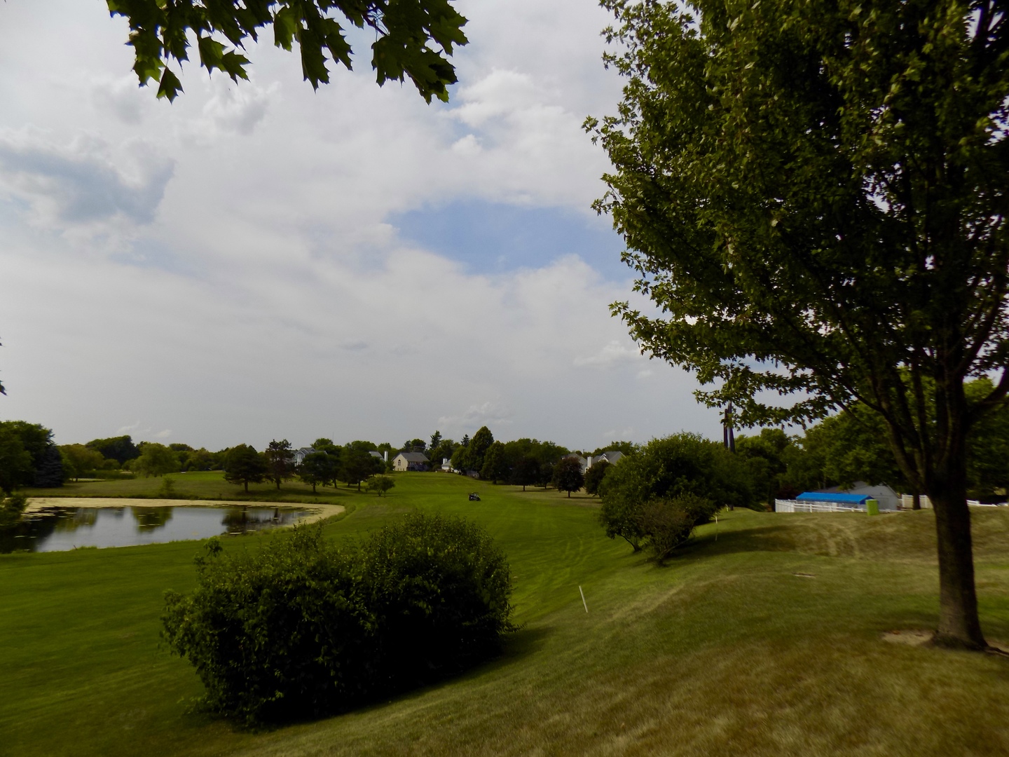 702 Chandler Road Gurnee, IL 60031 - Photo 21 of 26 a view of a lake with houses in the back