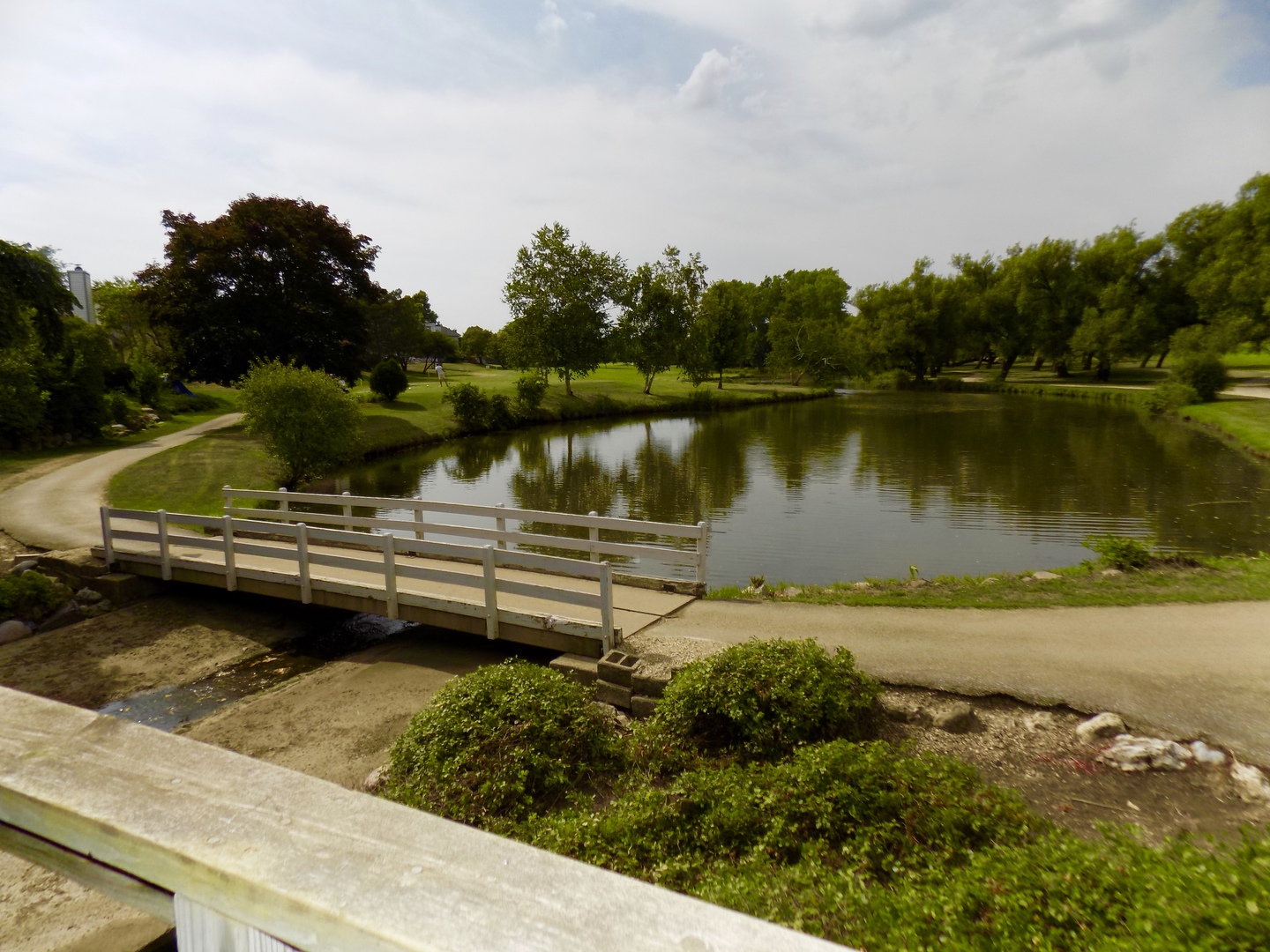 702 Chandler Road Gurnee, IL 60031 - Photo 23 of 26 a view of a lake with a house in the background