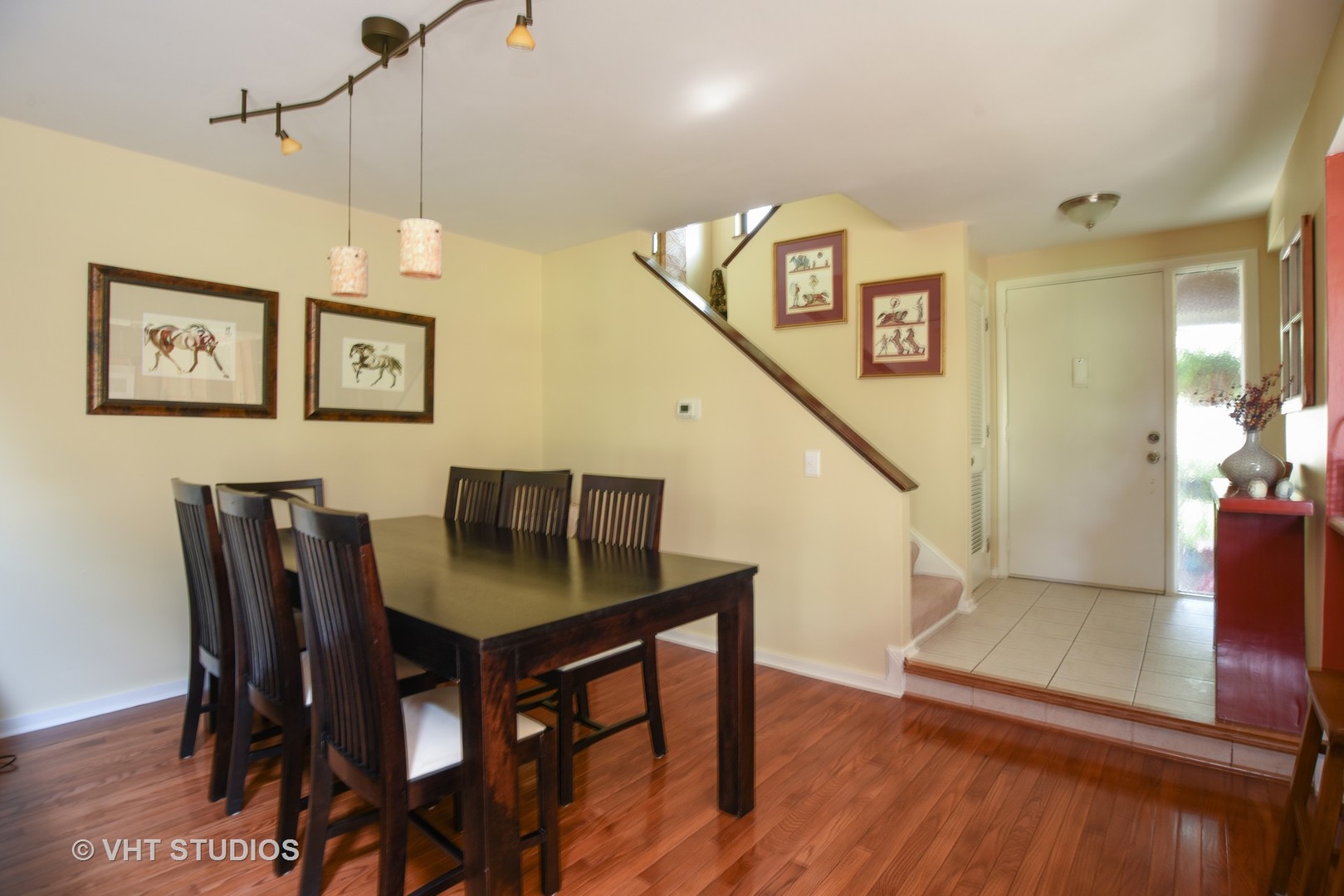 702 Chandler Road Gurnee, IL 60031 - Photo 3 of 26 a view of a dining room with furniture and wooden floor