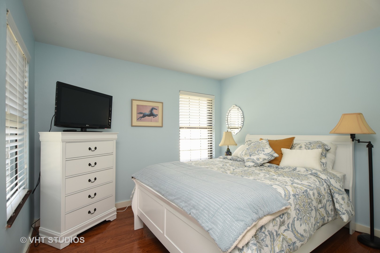 702 Chandler Road Gurnee, IL 60031 - Photo 9 of 26 a bedroom with a bed and a flat screen tv