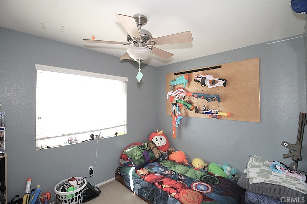 924 Condor Street Barstow, CA 92311 - Photo 29 of 52 a bedroom with furniture and a window