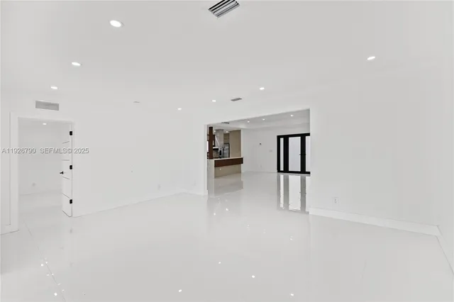 a view of an empty room with a balcony