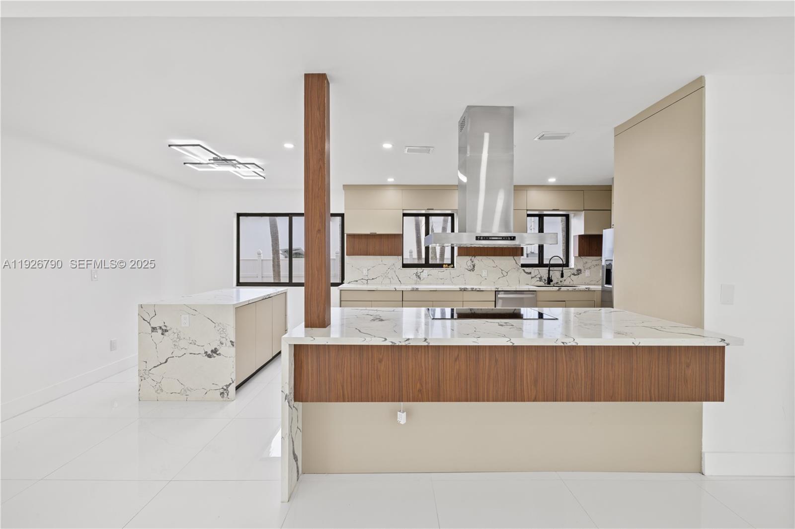 1200 Cleveland Road Miami Beach, FL 33141 - Photo 13 of 41 a large white kitchen with cabinets