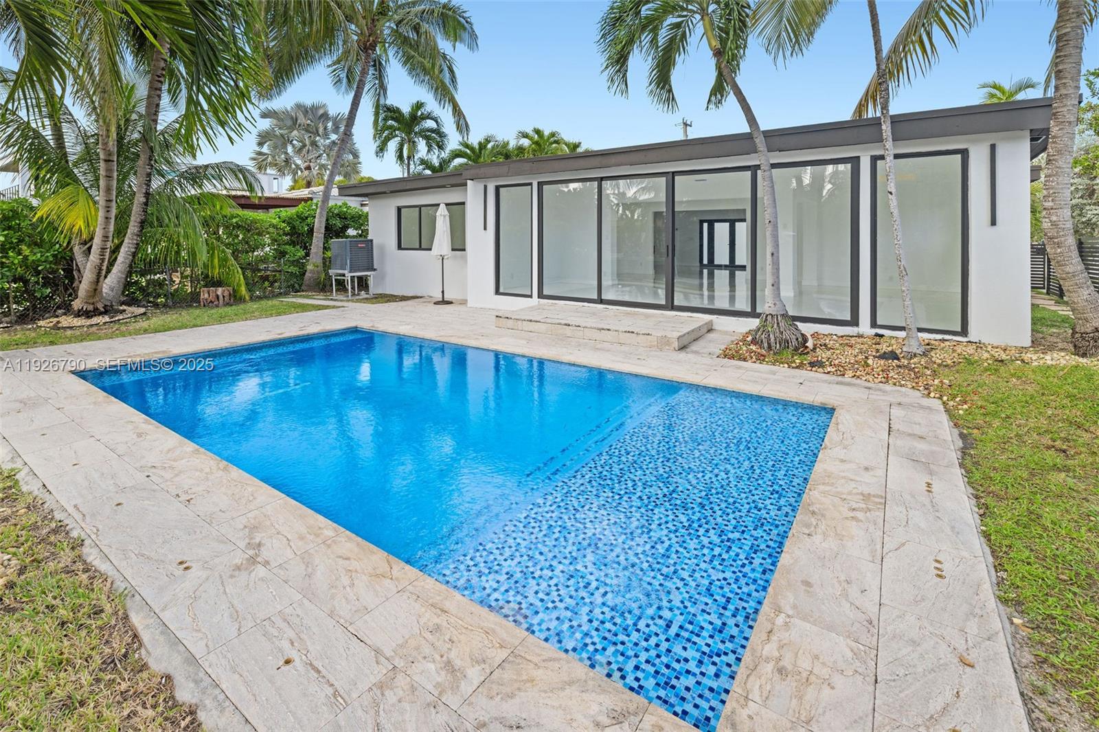 1200 Cleveland Road Miami Beach, FL 33141 - Photo 40 of 41 a view of swimming pool with palm trees