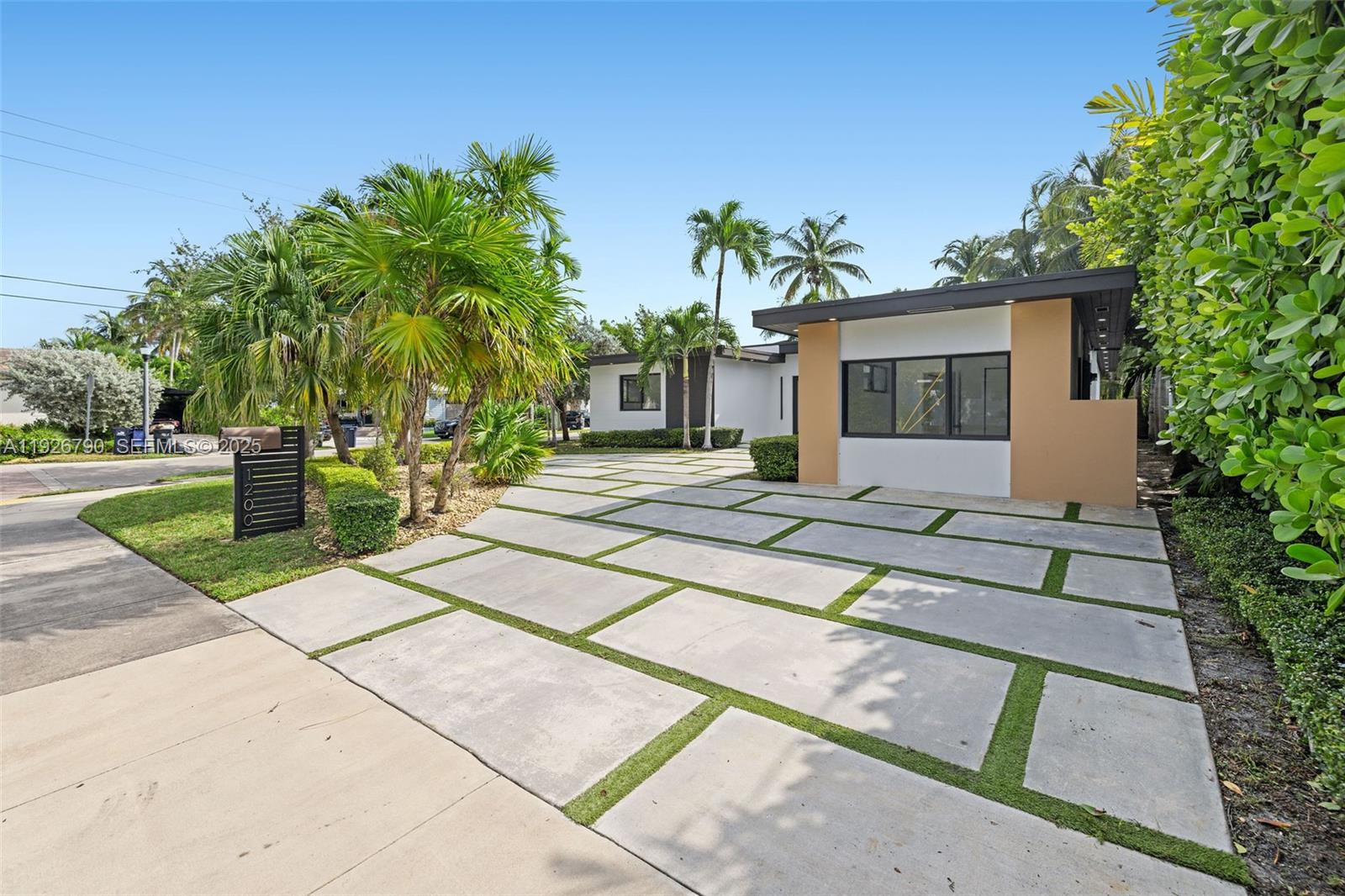 1200 Cleveland Road Miami Beach, FL 33141 - Photo 9 of 41 a house with yard and trees in the background
