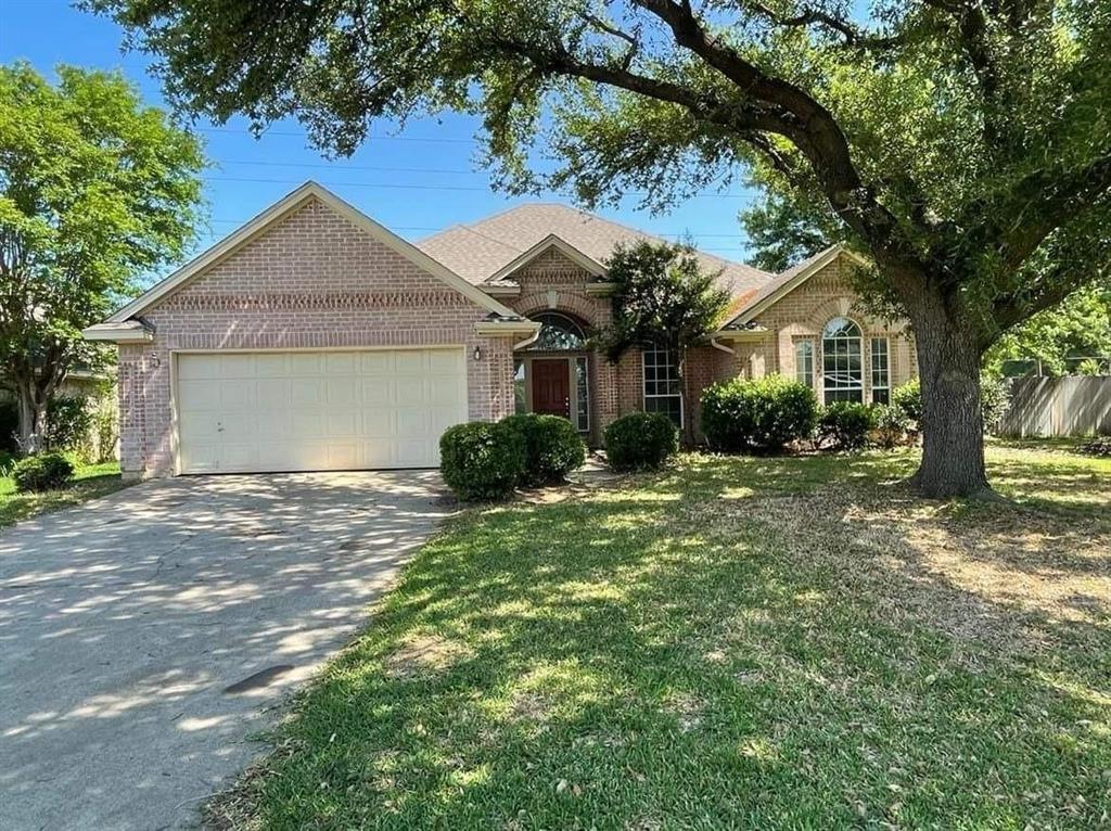 492 Shade Tree Circle Hurst, TX 76054 - Photo 1 of 20 a front view of a house with garden