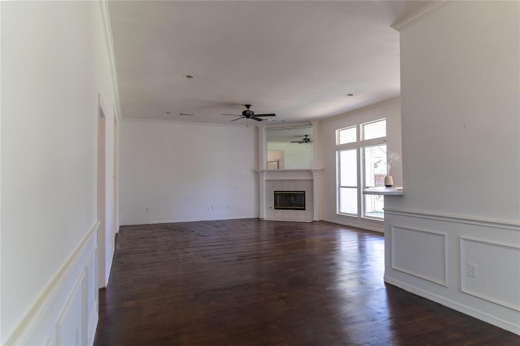 492 Shade Tree Circle Hurst, TX 76054 - Photo 13 of 20 wooden floor in an empty room with a window