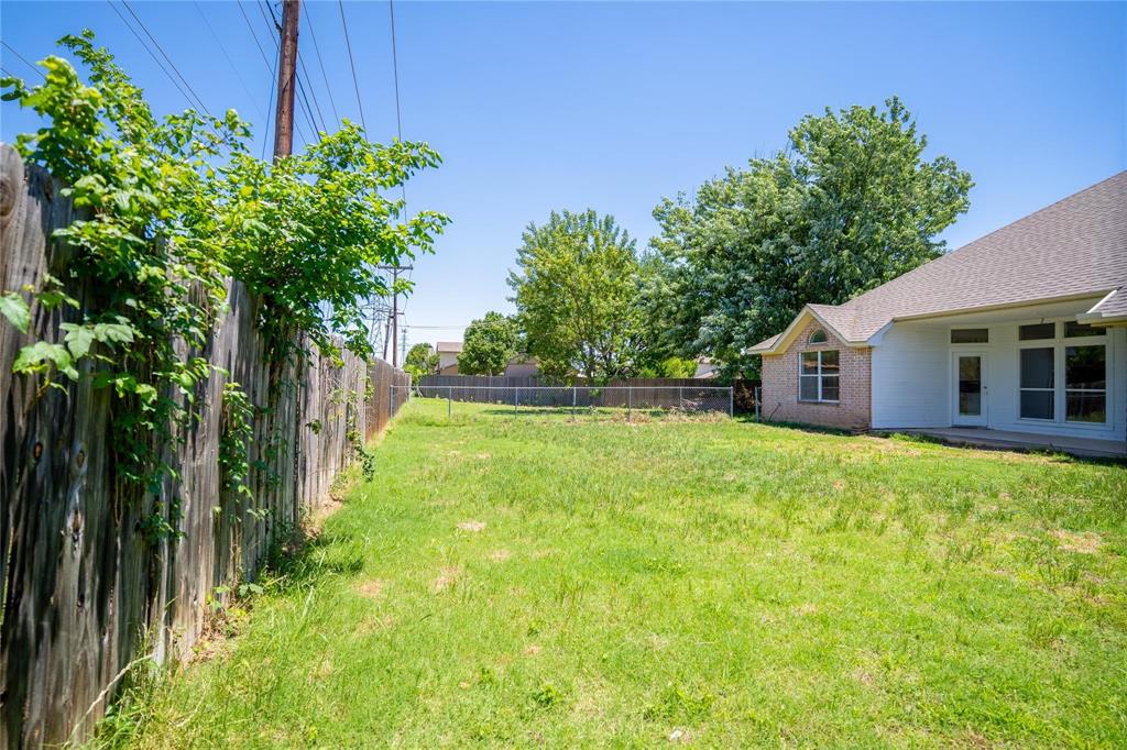 492 Shade Tree Circle Hurst, TX 76054 - Photo 5 of 20 a view of a house with backyard and garden