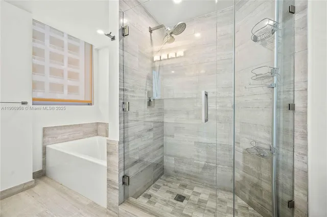 a bathroom with a shower and a bathtub