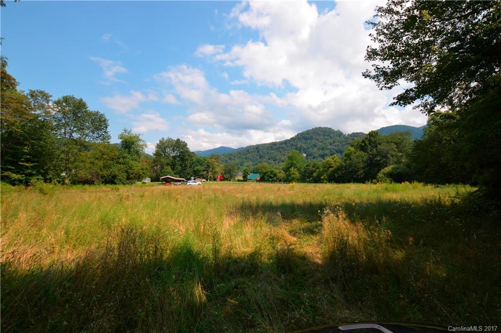 85 Setzercove Road Maggie Valley, NC 28751 - Photo 8 of 11 a view of a lake from a yard