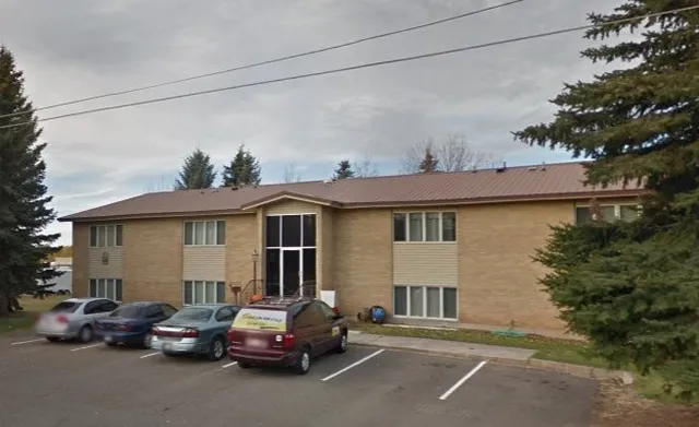 a view of a car park in front of house