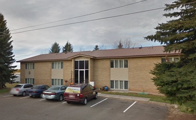 a view of a car park in front of house