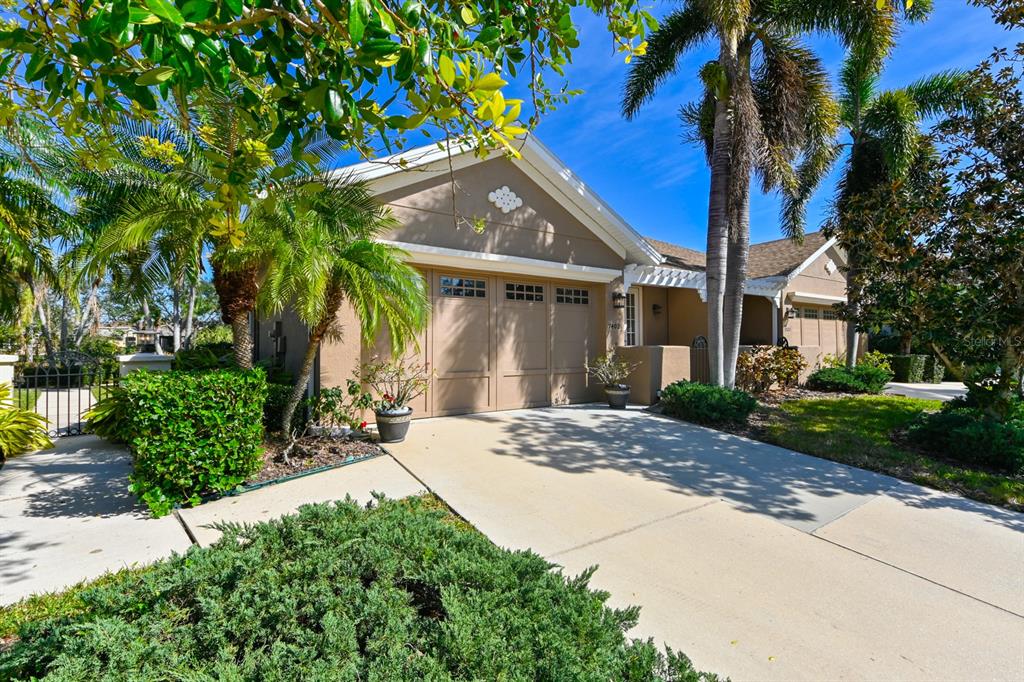 7402 Hamilton Road Bradenton, FL 34209 - Photo 1 of 1 front view of house with a yard and potted plants