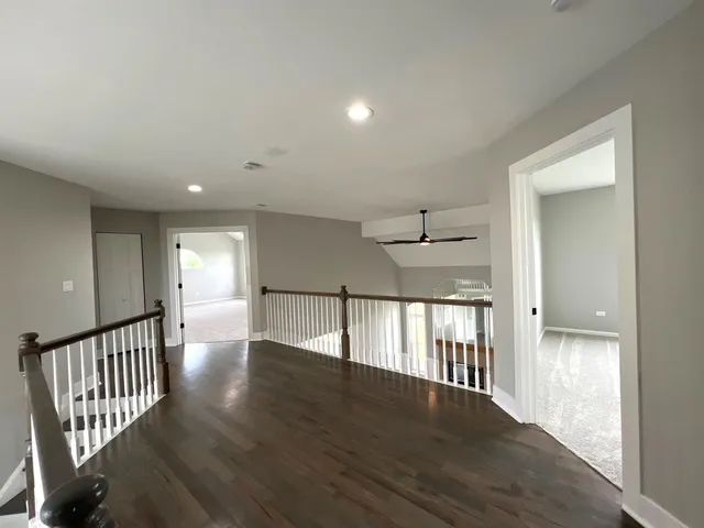 a bathroom with a granite countertop sink a mirror and a shower