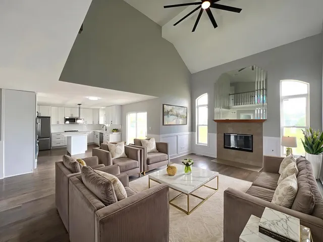 a living room with furniture and a fireplace