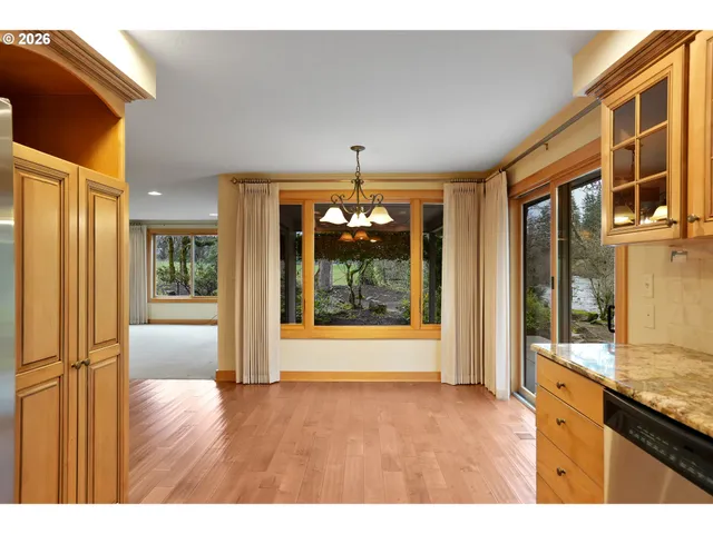 a kitchen with a sink and large window
