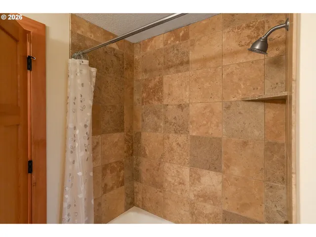 a view of a livingroom with a ceiling fan and a window