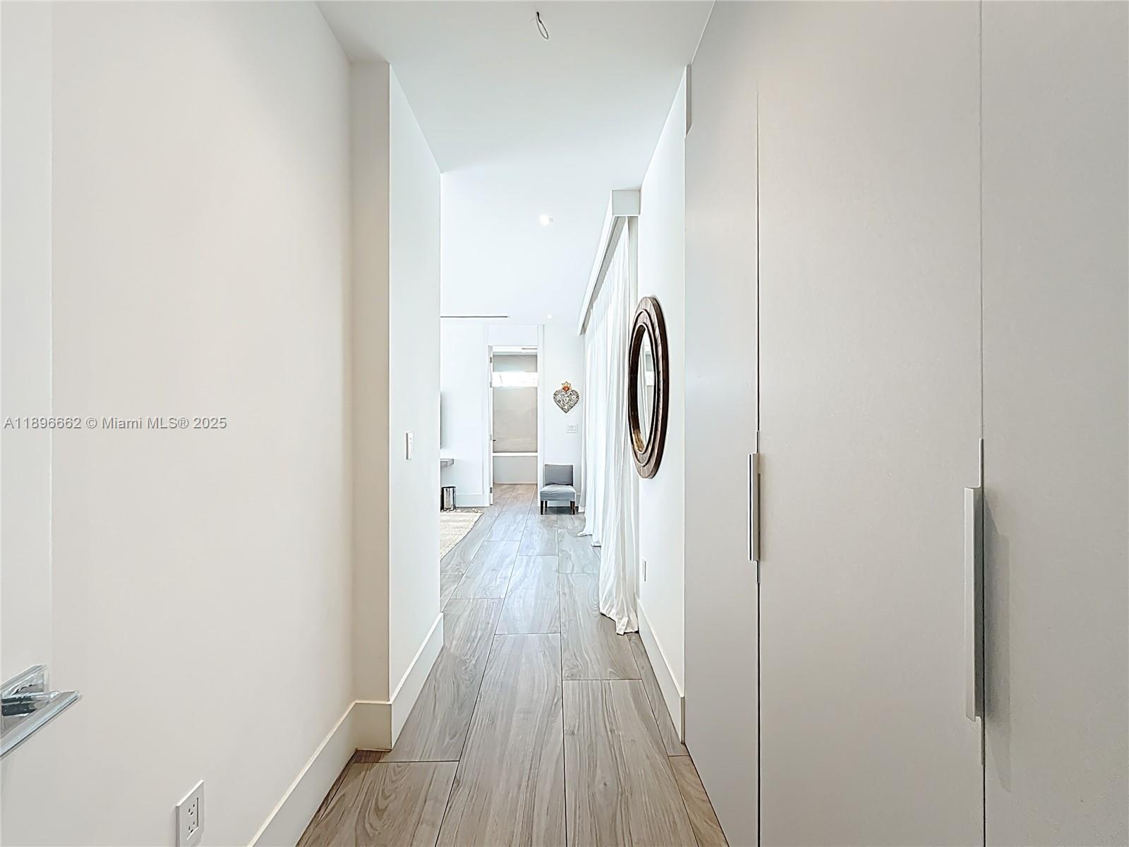Key Biscayne Key Biscayne, FL 33149 - Photo 22 of 43 a view of a hallway with wooden floor