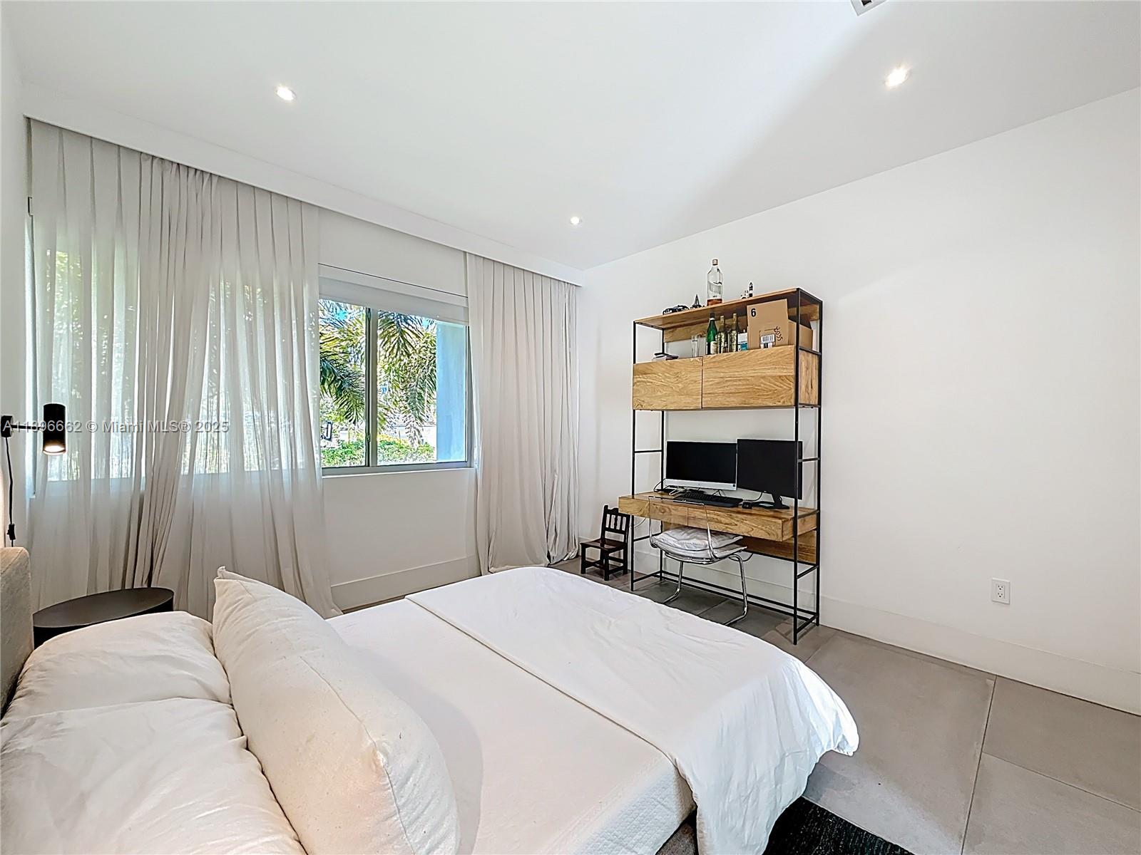 Key Biscayne Key Biscayne, FL 33149 - Photo 31 of 43 a bedroom with a bed and a tv