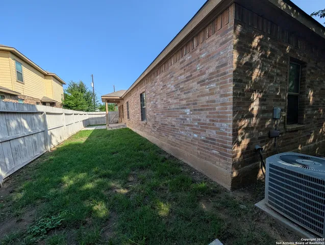 a backyard of a house with lots of green space
