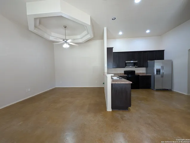 a kitchen with stainless steel appliances a stove a refrigerator and a sink