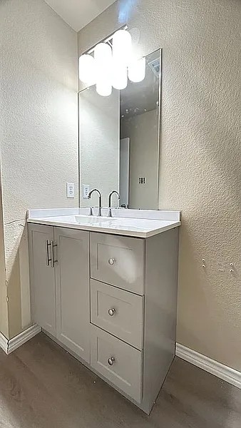 5211 Viewpoint Drive Austin, TX 78744 - Photo 16 of 25 a bathroom with a sink and a mirror