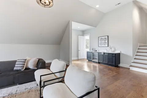 a view of a balcony dining table and chairs