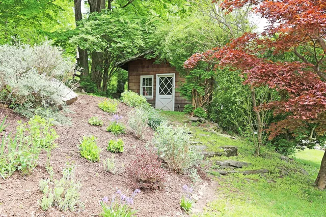 a house view with a garden space