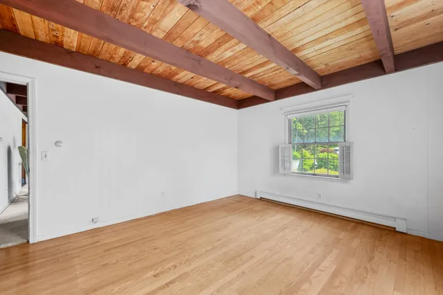 a bathroom with a sink toilet and a mirror