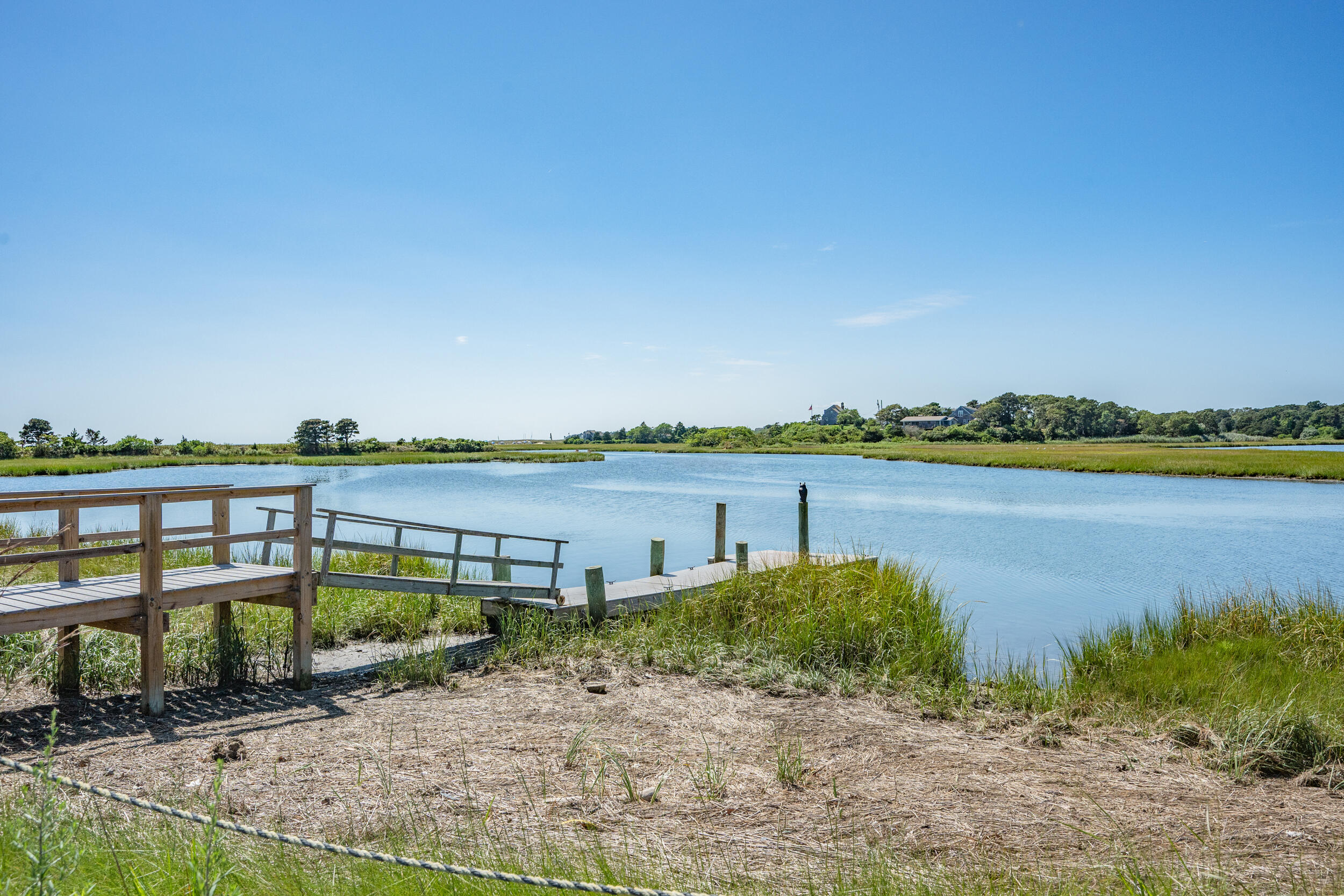 114 Bucks Creek Road Chatham, MA 02633 - Photo 3 of 43 a view of a lake with a big yard