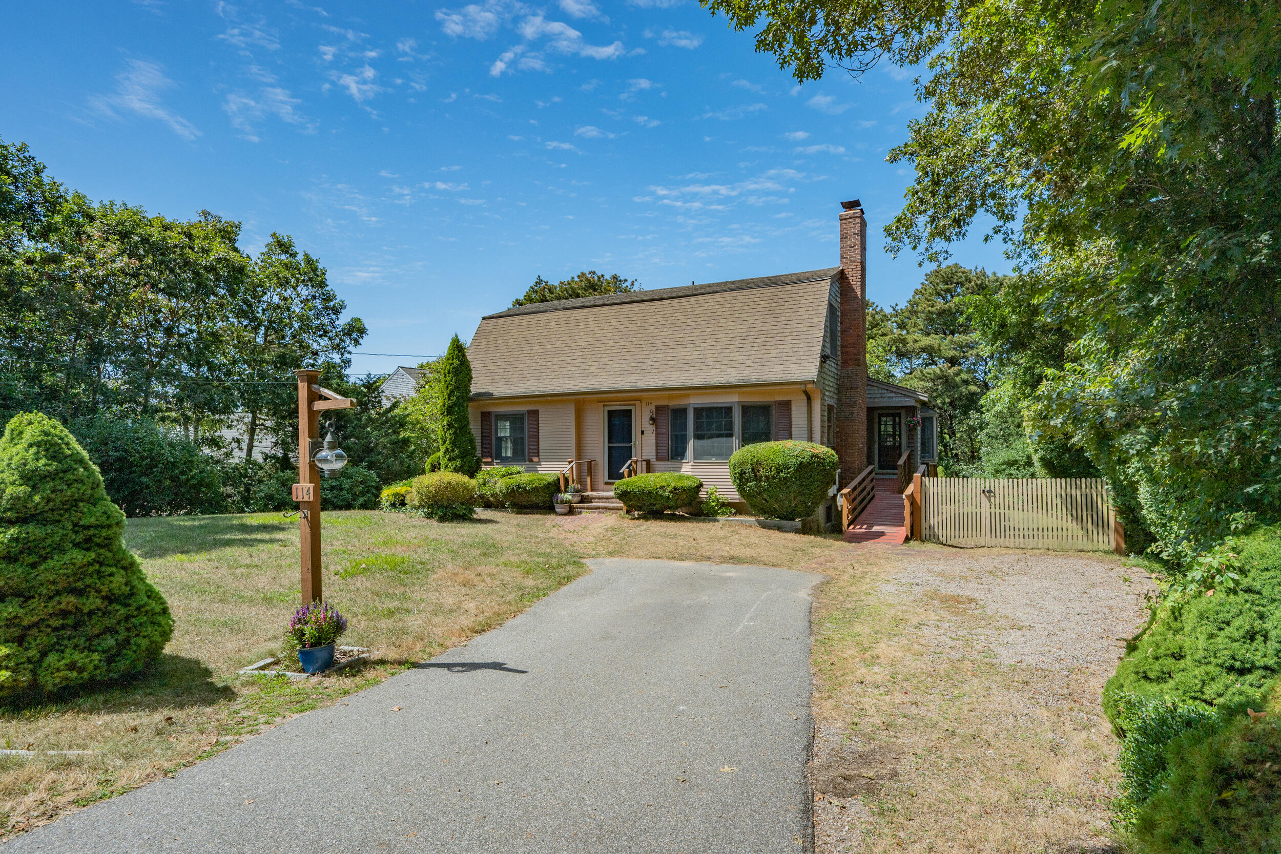 114 Bucks Creek Road Chatham, MA 02633 - Photo 6 of 43 a front view of a house with a yard