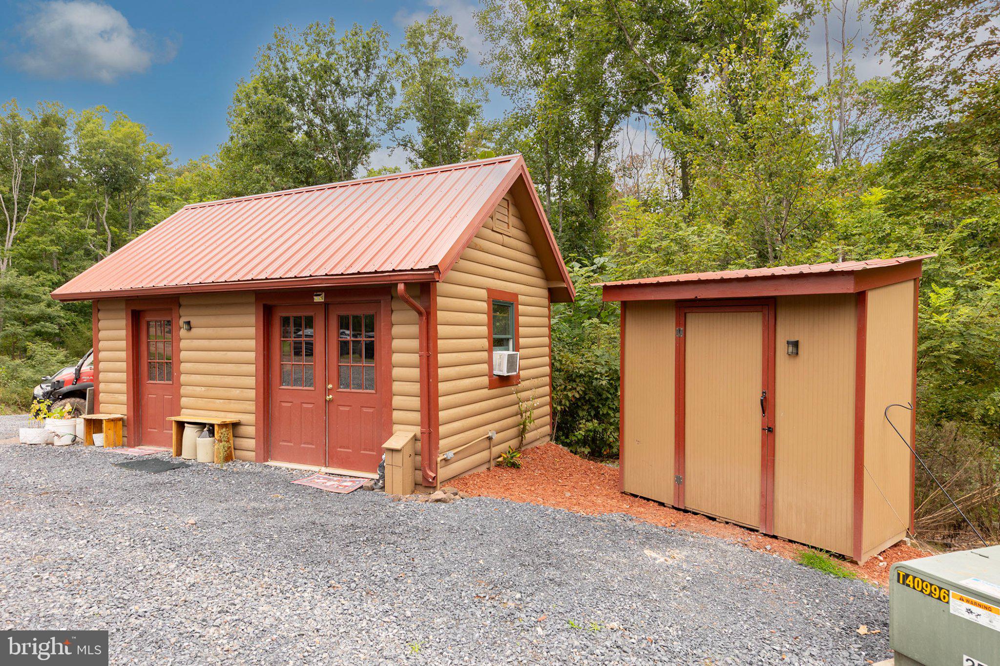 1305 Whispering Pines Road Paw Paw, WV 25434 - Photo 49 of 64 Lockable Waste Storage Shed next to Office Shed