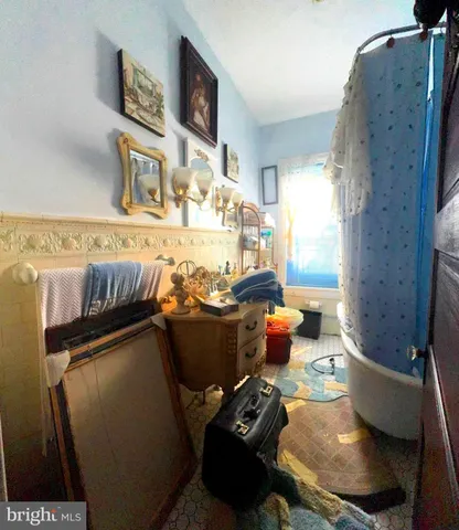 a bathroom with a sink toilet and a mirror